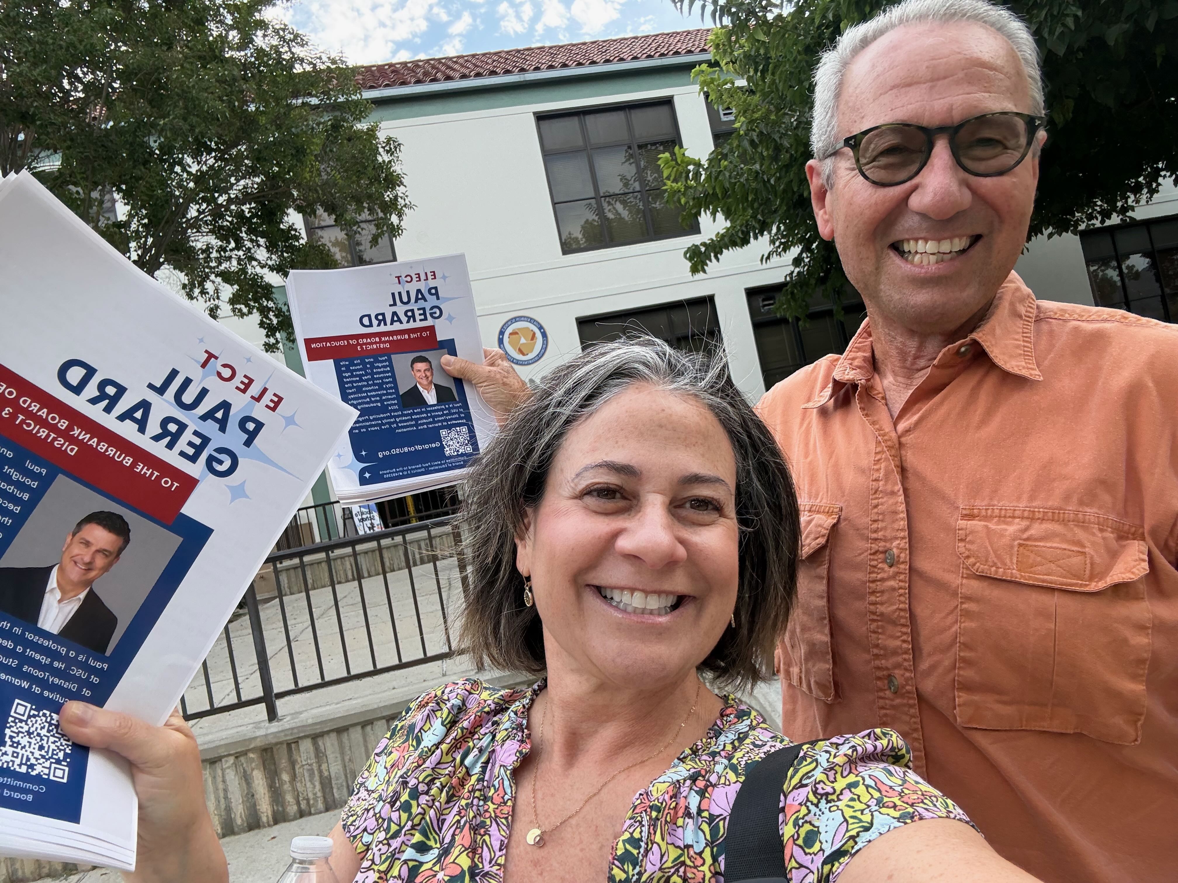 Paul and volunteers handing out flyers at Back to School Night